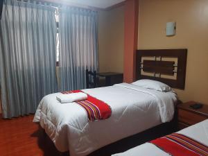 Cama ou camas em um quarto em Machupicchu Lodging