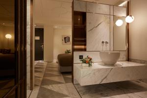 a bathroom with a sink and a mirror at 9 Brick Hotel in Seoul