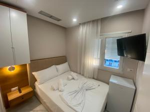 Postel nebo postele na pokoji v ubytování Hotel Margjokaj