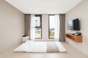 Katil atau katil-katil dalam bilik di CENTUMMARK Hotel YangYang