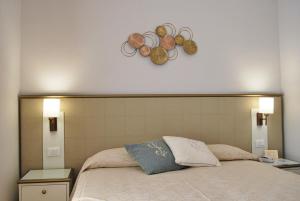 Postel nebo postele na pokoji v ubytování Hotel San Lino