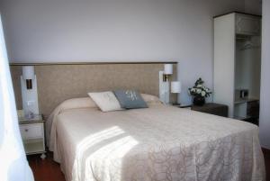 Postel nebo postele na pokoji v ubytování Hotel San Lino