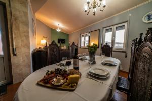a dining room table with a plate of food on it at Ocean Front Home - Casa Santo Antonio in São Mateus