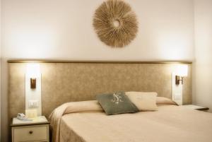 Postel nebo postele na pokoji v ubytování Hotel San Lino