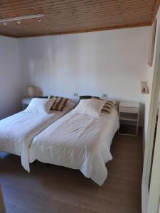 Postel nebo postele na pokoji v ubytování Ático Porto do Son