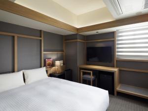 Katil atau katil-katil dalam bilik di LAMP LIGHT BOOKS HOTEL sapporo