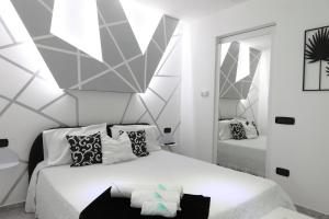 Ένα ή περισσότερα κρεβάτια σε δωμάτιο στο IsadeMar