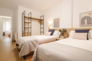 A bed or beds in a room at Elegante y Recién Reformado en Abando
