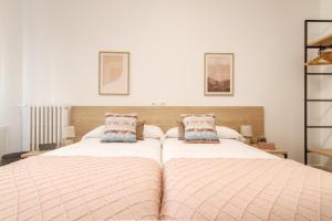 A bed or beds in a room at Elegante y Recién Reformado en Abando
