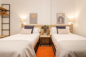 A bed or beds in a room at Elegante y Recién Reformado en Abando