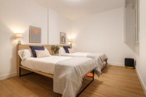 A bed or beds in a room at Elegante y Recién Reformado en Abando
