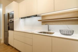 A kitchen or kitchenette at Elegante y Recién Reformado en Abando