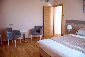 Postelja oz. postelje v sobi nastanitve Benjamin Hotel