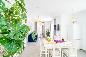 a dining room with a white table and chairs at Nona's Paradise Apartment - Free parking in Zaton