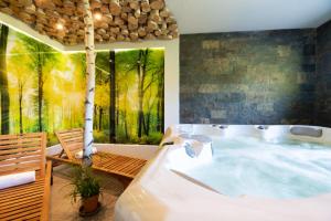 Posteľ alebo postele v izbe v ubytovaní Aparthotel Pod Stokiem z sauną i jacuzzi - szczyrkapartamenty