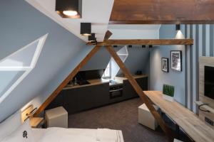 a room with a loft bed and a desk at Oldtown Studios by dasPaul in Nürnberg