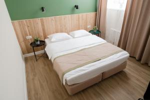 
Кровать или кровати в номере Отель «Ностальжи»
