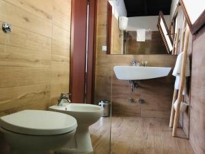 a bathroom with a toilet and a sink at Baia Dei Micenei in Otranto +109 photos