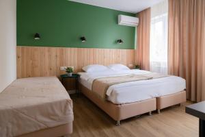 
Кровать или кровати в номере Отель «Ностальжи»
