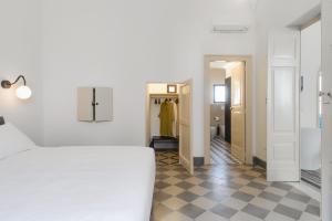 A bed or beds in a room at PALAZZO FRANGIPANE Még 37 kép