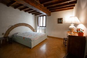 Posteľ alebo postele v izbe v ubytovaní Torre dei Sapiti Apartment