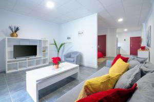 a living room with a couch and a tv at Loft Life 3 in Arrecife