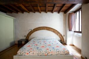 Posteľ alebo postele v izbe v ubytovaní Torre dei Sapiti Apartment