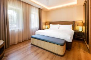 Ein Bett oder Betten in einem Zimmer der Unterkunft Divan Bodrum Palmira