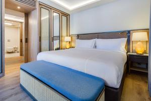 Ein Bett oder Betten in einem Zimmer der Unterkunft Divan Bodrum Palmira