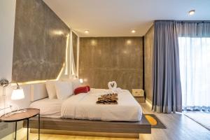 Voodi või voodid majutusasutuse Phi Phi Andaman Legacy Resort toas