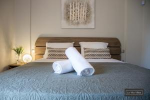 Postel nebo postele na pokoji v ubytování La Vita Villas