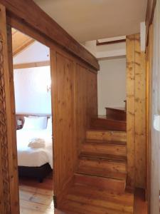 a room with a wooden floor and wooden walls at Hotel Bellevue Suites & Spa in Cortina dʼAmpezzo