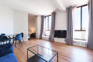 a living room with a couch and a glass table at Duomo Luxury Apartment IV in Milan