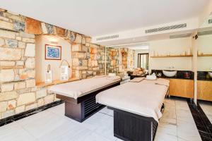 Ein Bett oder Betten in einem Zimmer der Unterkunft Divan Bodrum Palmira