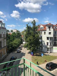 a view of a city street with cars parked at DK Premium Romantyczna Secesja in Olsztyn