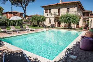 a swimming pool in front of a house at Domus Angeli in Assisi