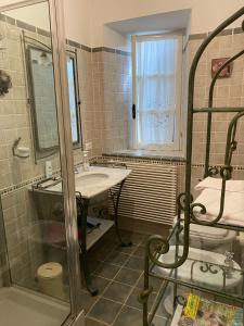 a bathroom with a sink and a shower at B&B H.M. in Sonnino