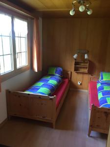 Tempat tidur dalam kamar di Chalet Gärlich