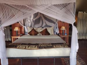 Tempat tidur dalam kamar di Serengeti Sound of Silence