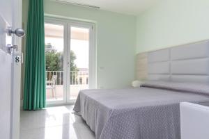 Ένα ή περισσότερα κρεβάτια σε δωμάτιο στο 4essences Boutique Rooms