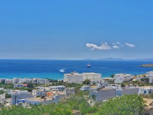 a view of a city and the ocean at Kionia Panorama Studios in Kionia