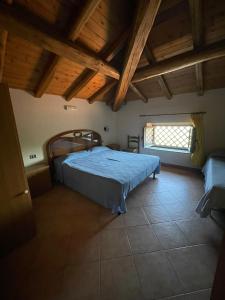 Posteľ alebo postele v izbe v ubytovaní Il noceto dell'Etna