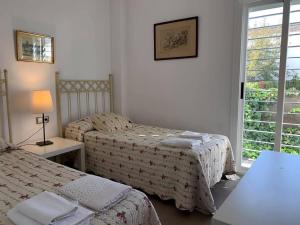 מיטה או מיטות בחדר ב-Casa Rural Nacimiento del Huéznar - Tomillo 17