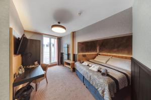 Voodi või voodid majutusasutuse Atrium Hotel - Family friendly toas