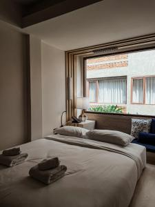 Ліжко або ліжка в номері NORN Nimman13 Boutique Hotel Chiang Mai