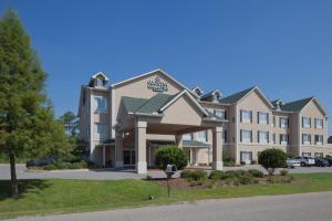 a rendering of the front of a hotel at Country Inn & Suites by Radisson, Saraland, AL in Saraland