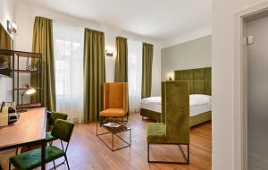 a hotel room with a bed and a desk at Hotel Garden Court in Prague +37 photos