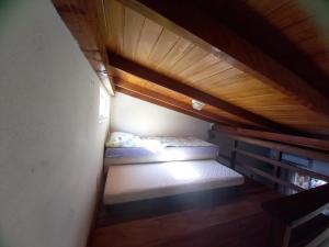 Ένα ή περισσότερα κρεβάτια σε δωμάτιο στο Loft praia Porto Belo
