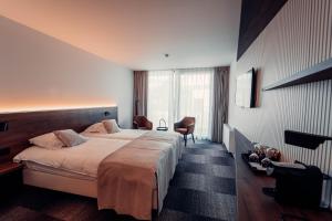 Postel nebo postele na pokoji v ubytování Casino Hotel