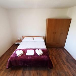 Postel nebo postele na pokoji v ubytování Modern family apartment ZARA
